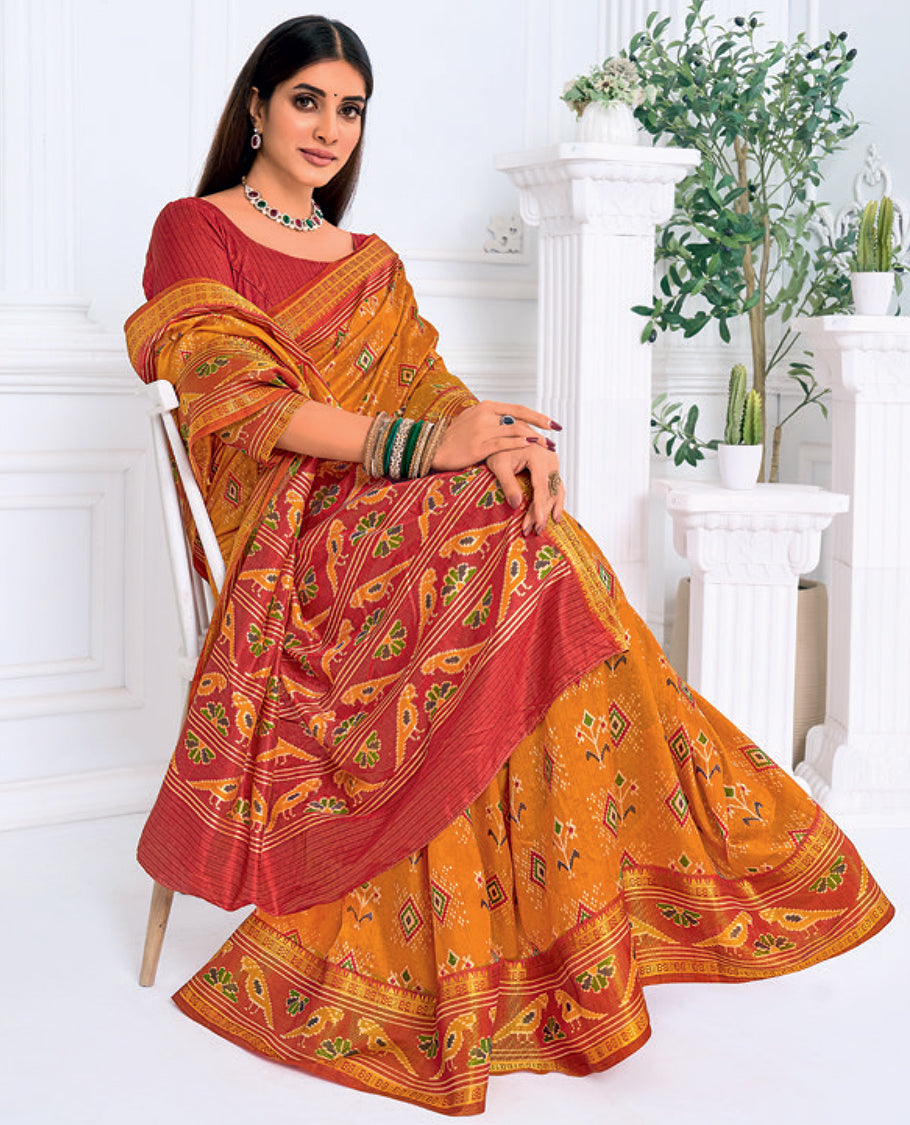 Orange Fancy Raw Silk Designer Catalog Saree, Prettified with Patola-Print, a Contrast Patola Border, Pallu of Patola Parrot Design, and a Contrast Blouse