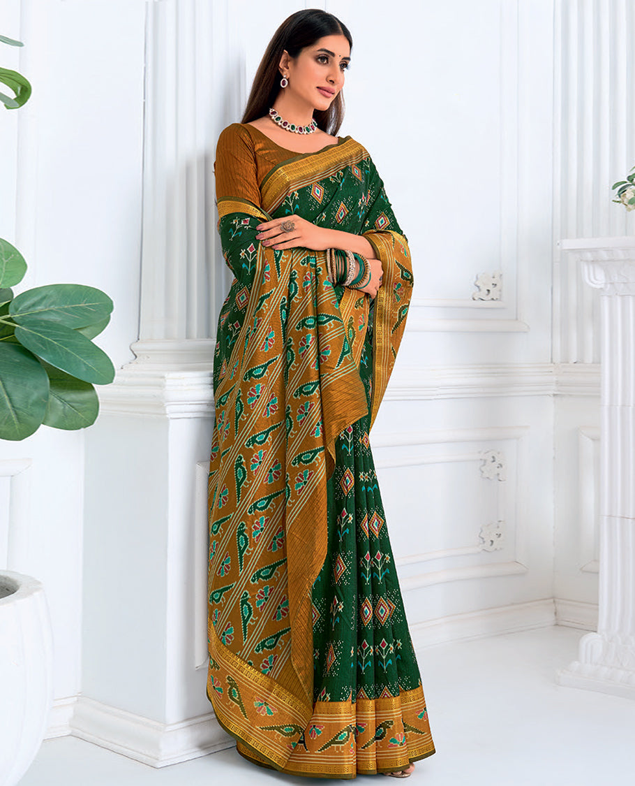 Dark Green Fancy Raw Silk Designer Catalog Saree, Prettified with Patola-Print, a Contrast Patola Border, Pallu of Patola Parrot Design, and a Contrast Blouse