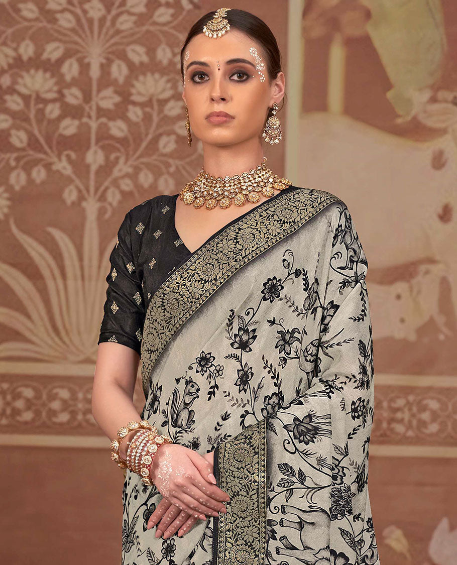 Beige floral and sparrow printed designer saree, contrast floral creeper zari border, and zari striped pallu