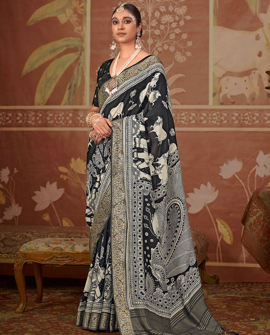 Black lotus and Pichwai cow printed designer saree, floral creeper zari border, and zari striped pallu