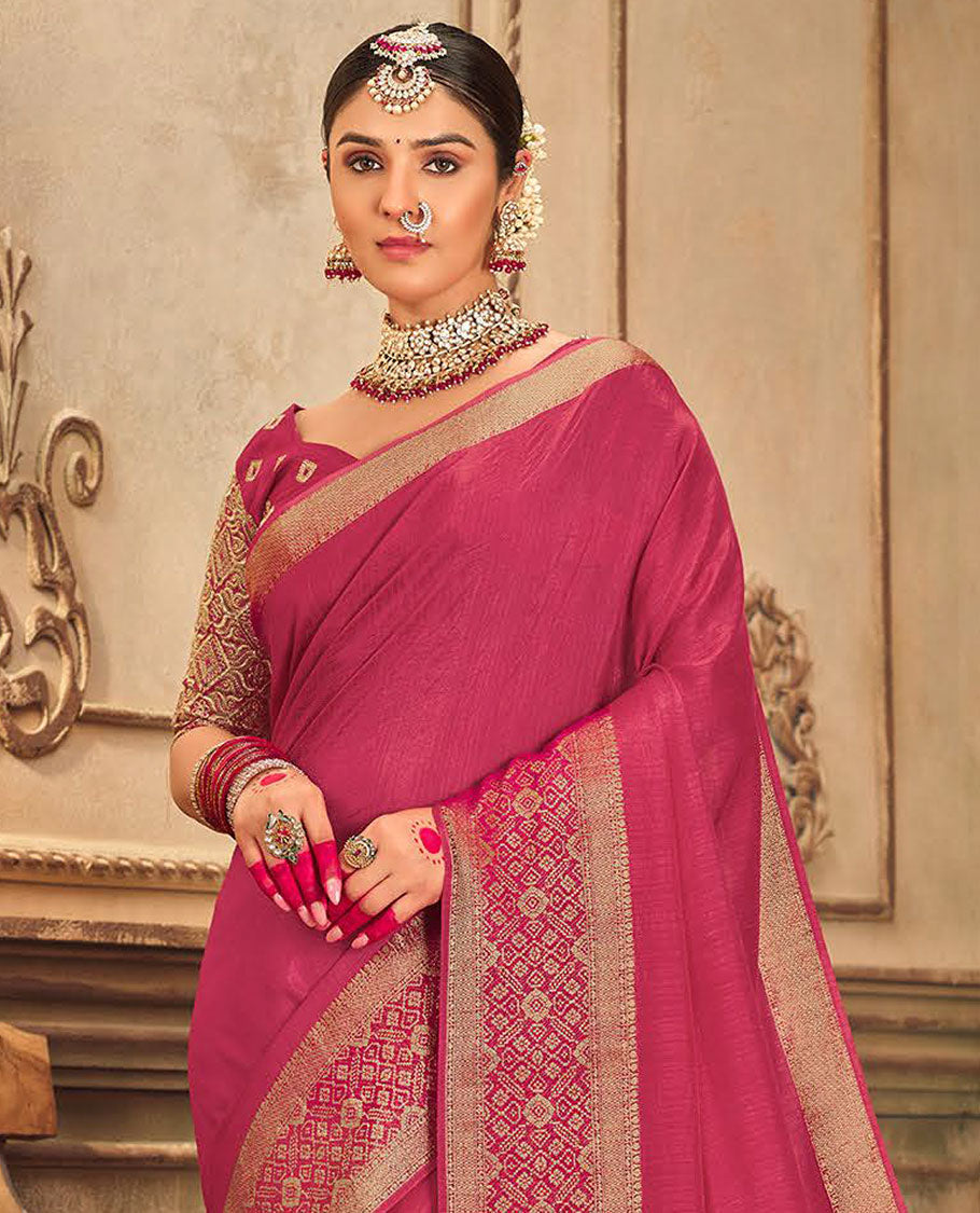 Pink plain designer saree, patola-style motifs woven border, and zari striped pallu