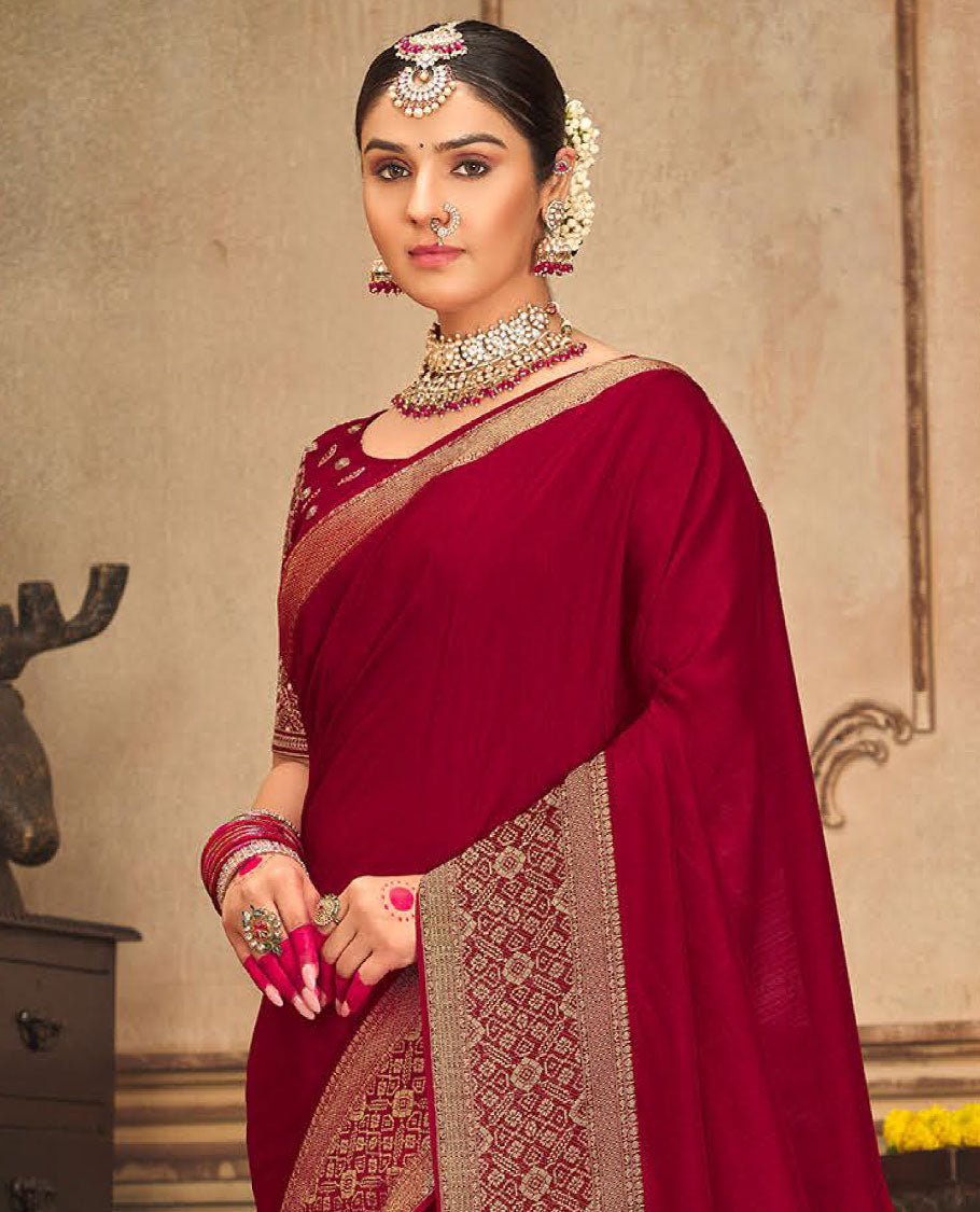 Red plain designer saree, patola-style motifs woven border, and zari striped pallu