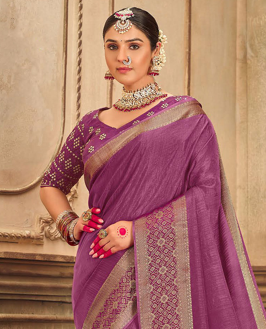 Purple plain designer saree, patola-style motifs woven border, and zari striped pallu