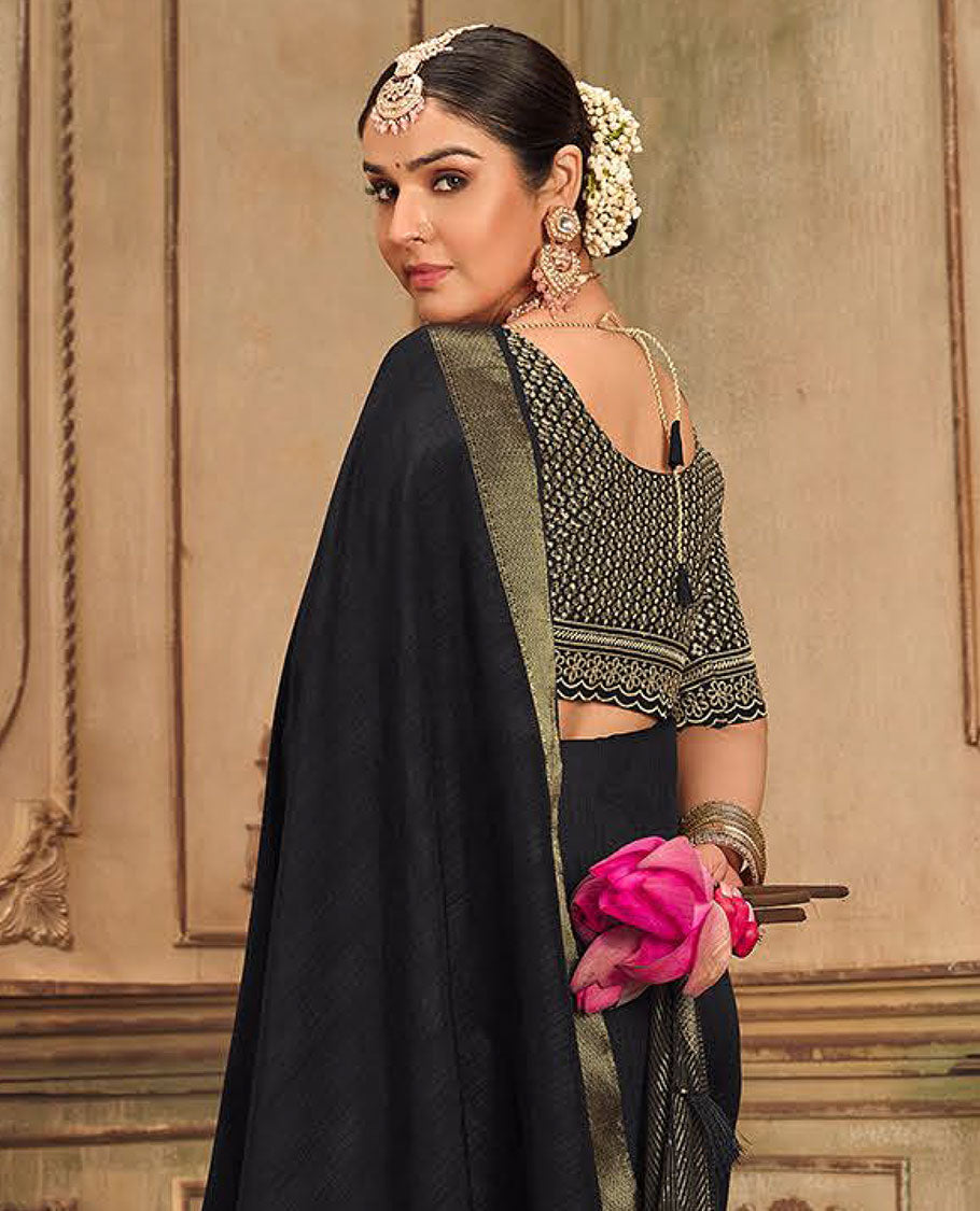 Black plain designer saree, patola-style motifs woven border, and zari striped pallu