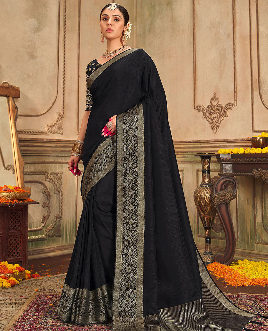 Black plain designer saree, patola-style motifs woven border, and zari striped pallu