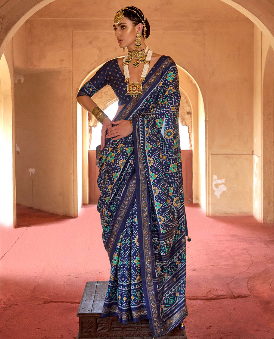 Blue double-ikkat patola printed designer catalog saree, stone work border, and patola patterned pallu