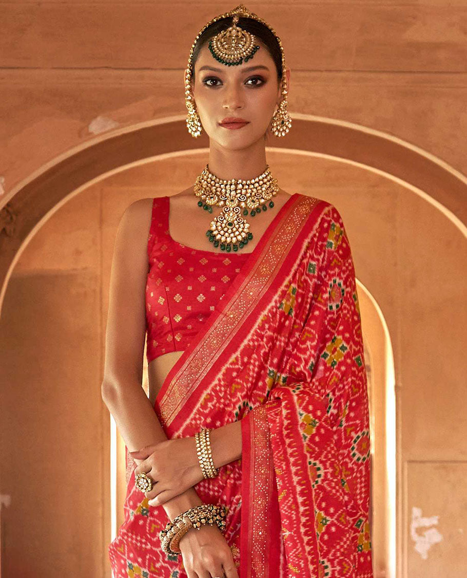 Red double-ikkat patola printed designer catalog saree, stone work border, and patola patterned pallu