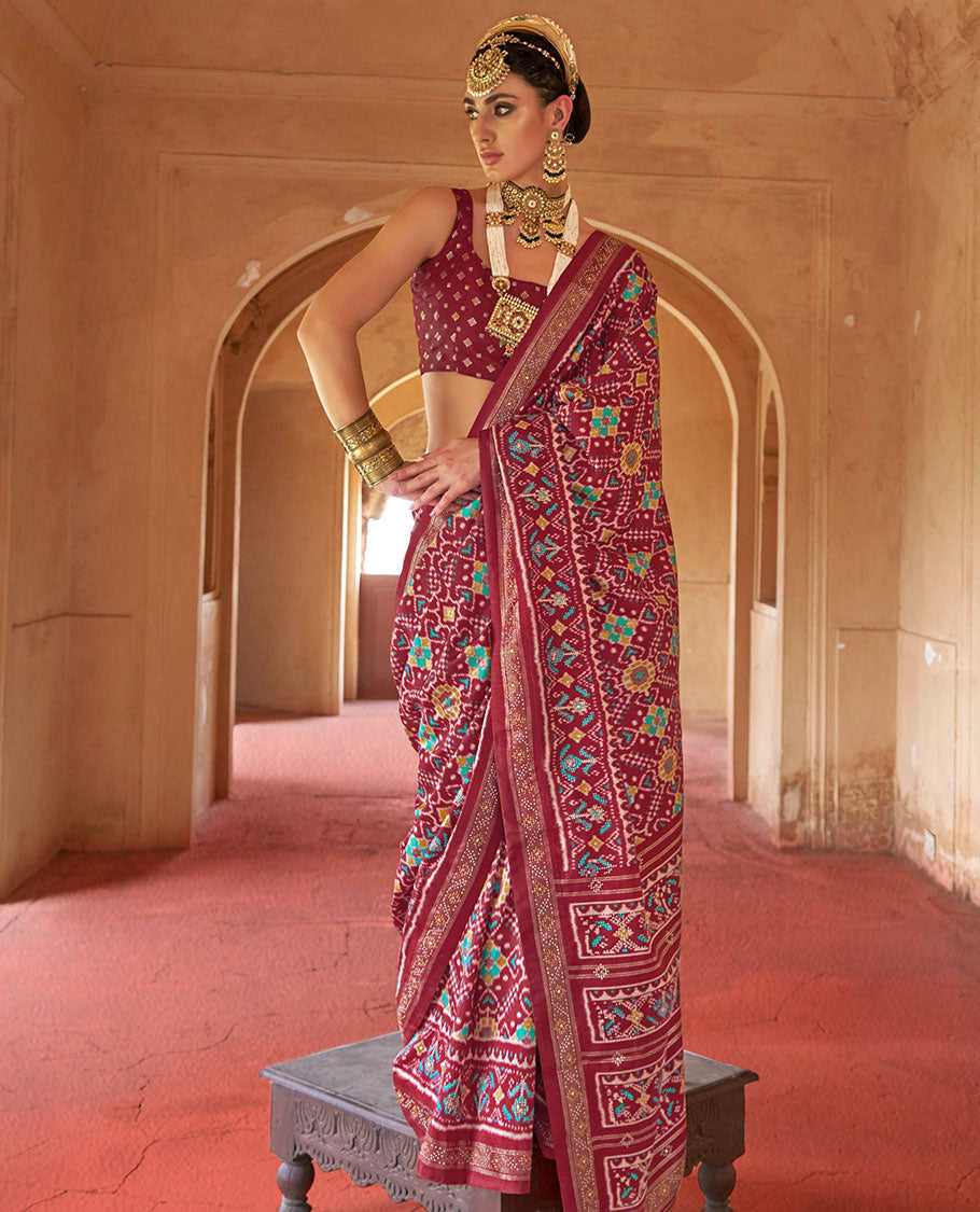Burgundy double-ikkat patola printed designer catalog saree, stone work border, and patola patterned pallu