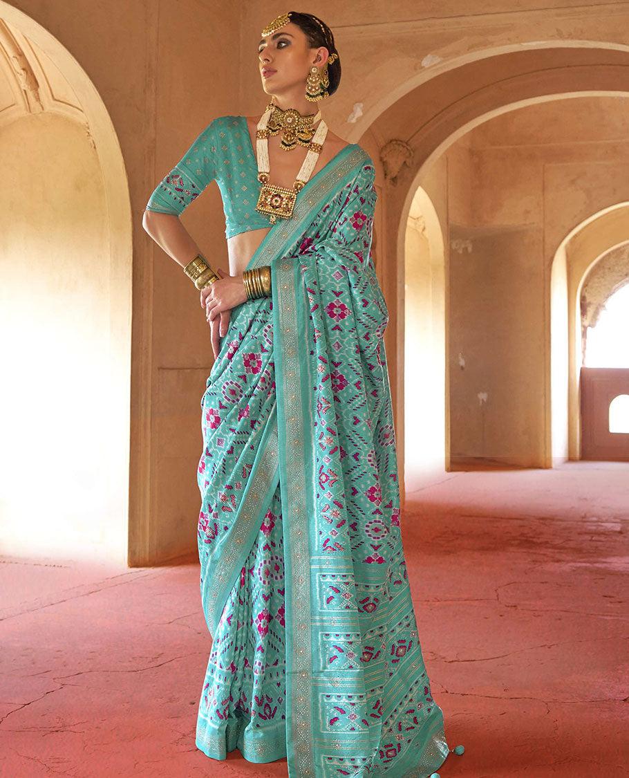 Turquoise double-ikkat patola printed designer catalog saree, stone work border, and patola patterned pallu