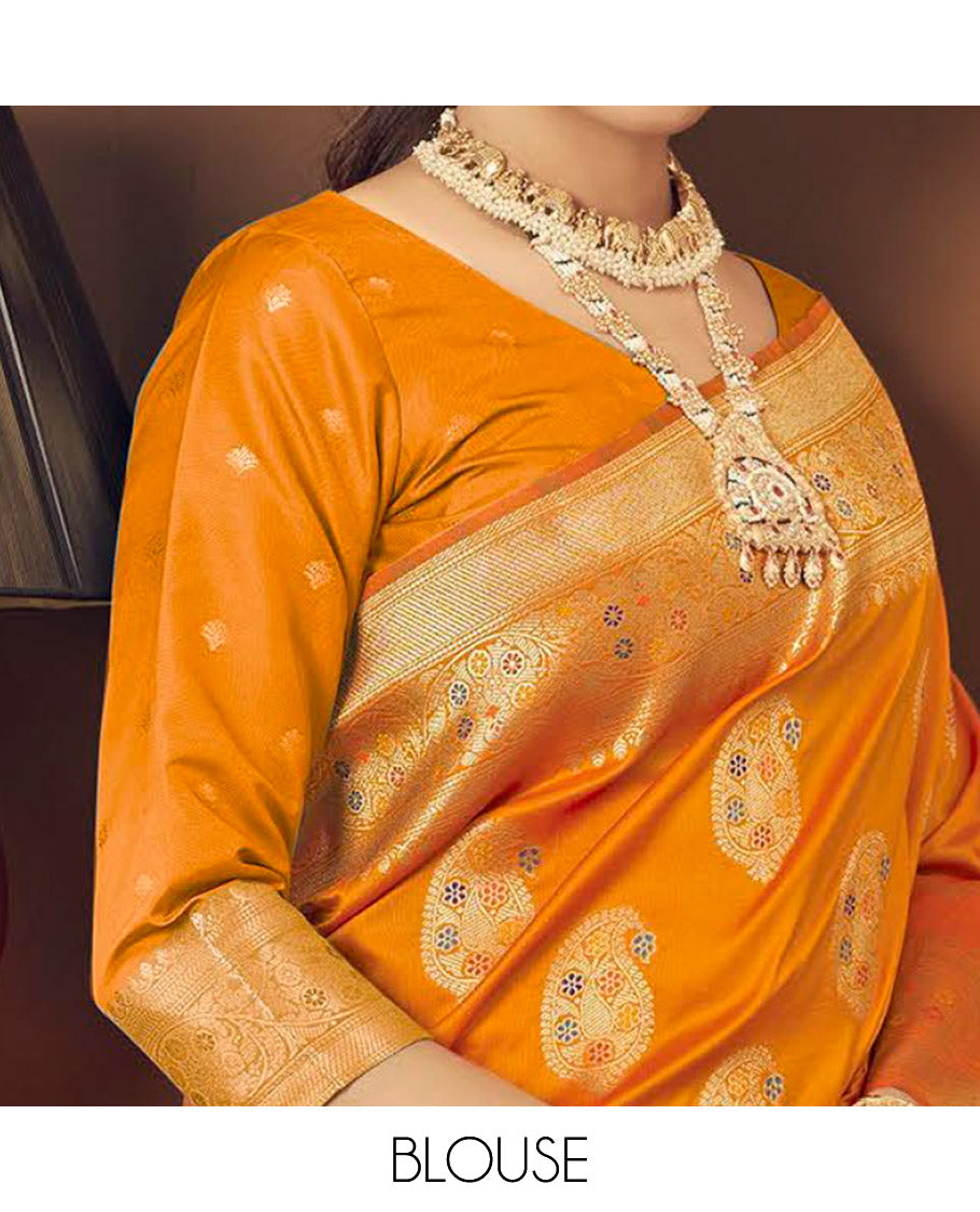 Orange Banaras Designer Catalog Saree, Ornamented with Paisley Meena Buttas, Highlighted by a Traditional Meenakari Border, Grand Pallu, and a Matching Blouse