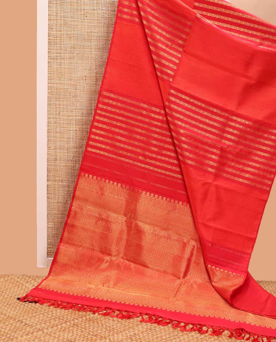 Borderless red geometric design kancheepuram silk saree with intricate floral zari design pallu