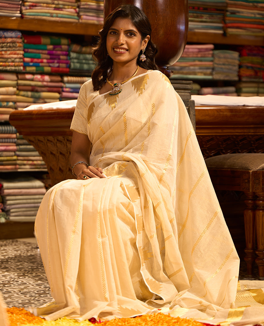 Cream striped kasavu saree with self temple border & gold zari striped pallu