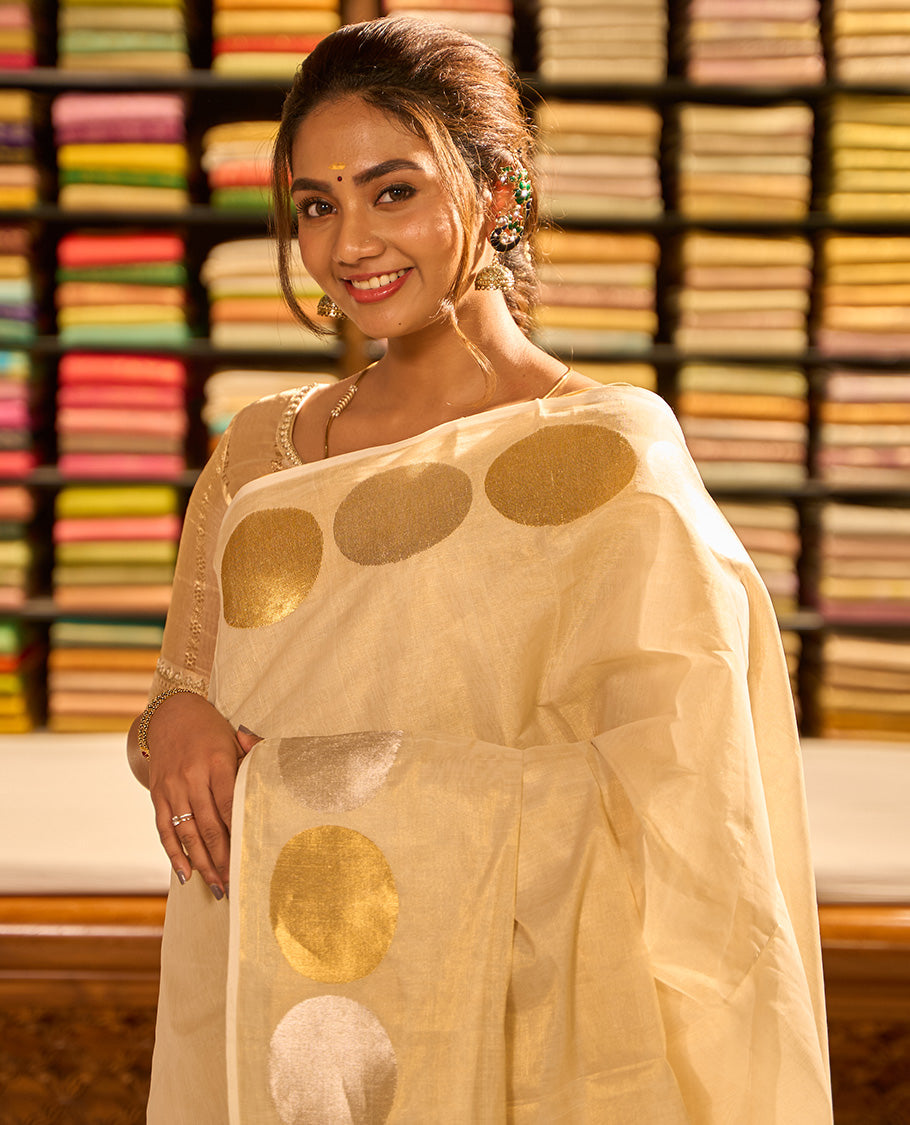 Cream kasavu saree with self geometric design border & struiped pallu