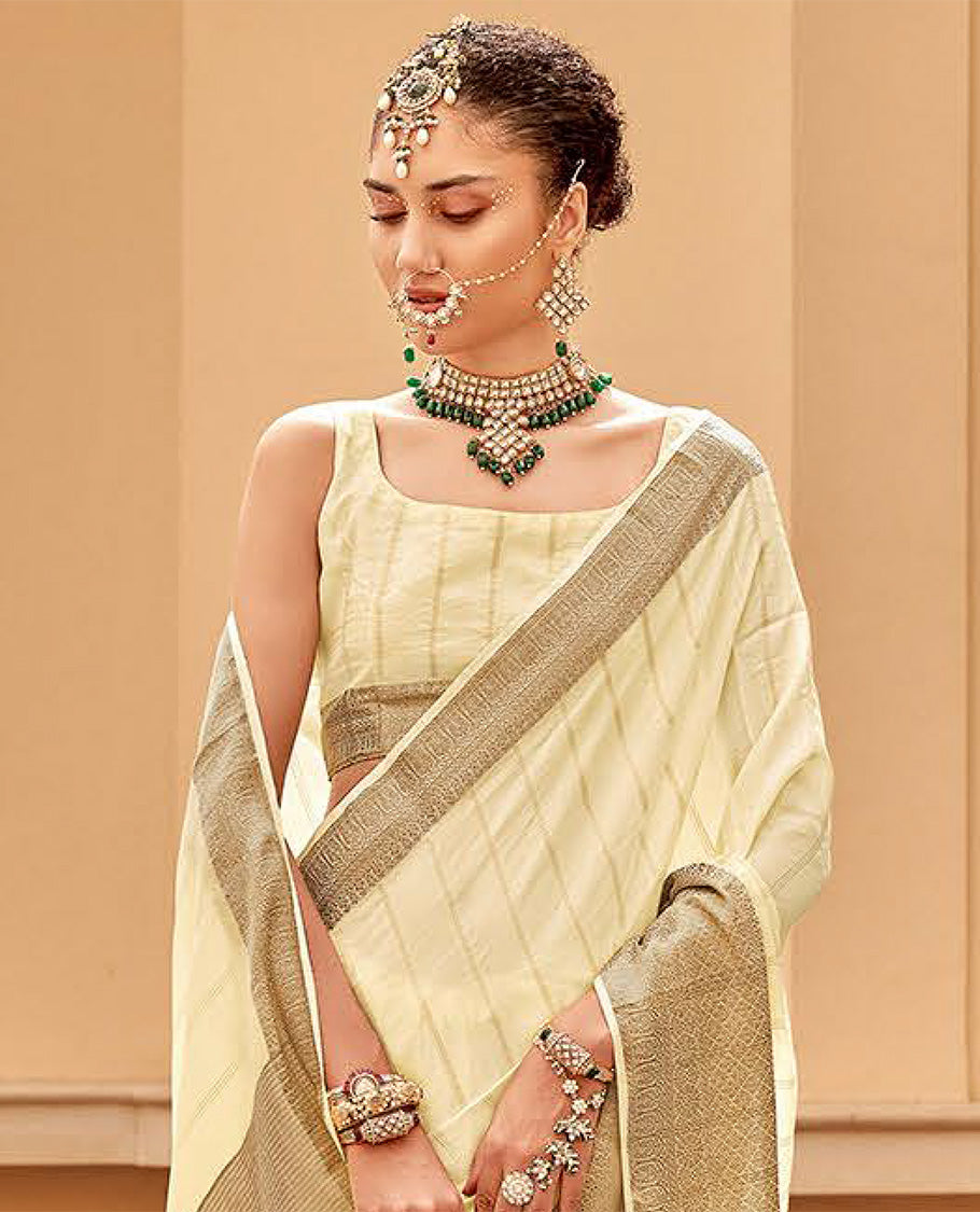 Cream striped catalouge designer saree with self zari design border & checked pallu