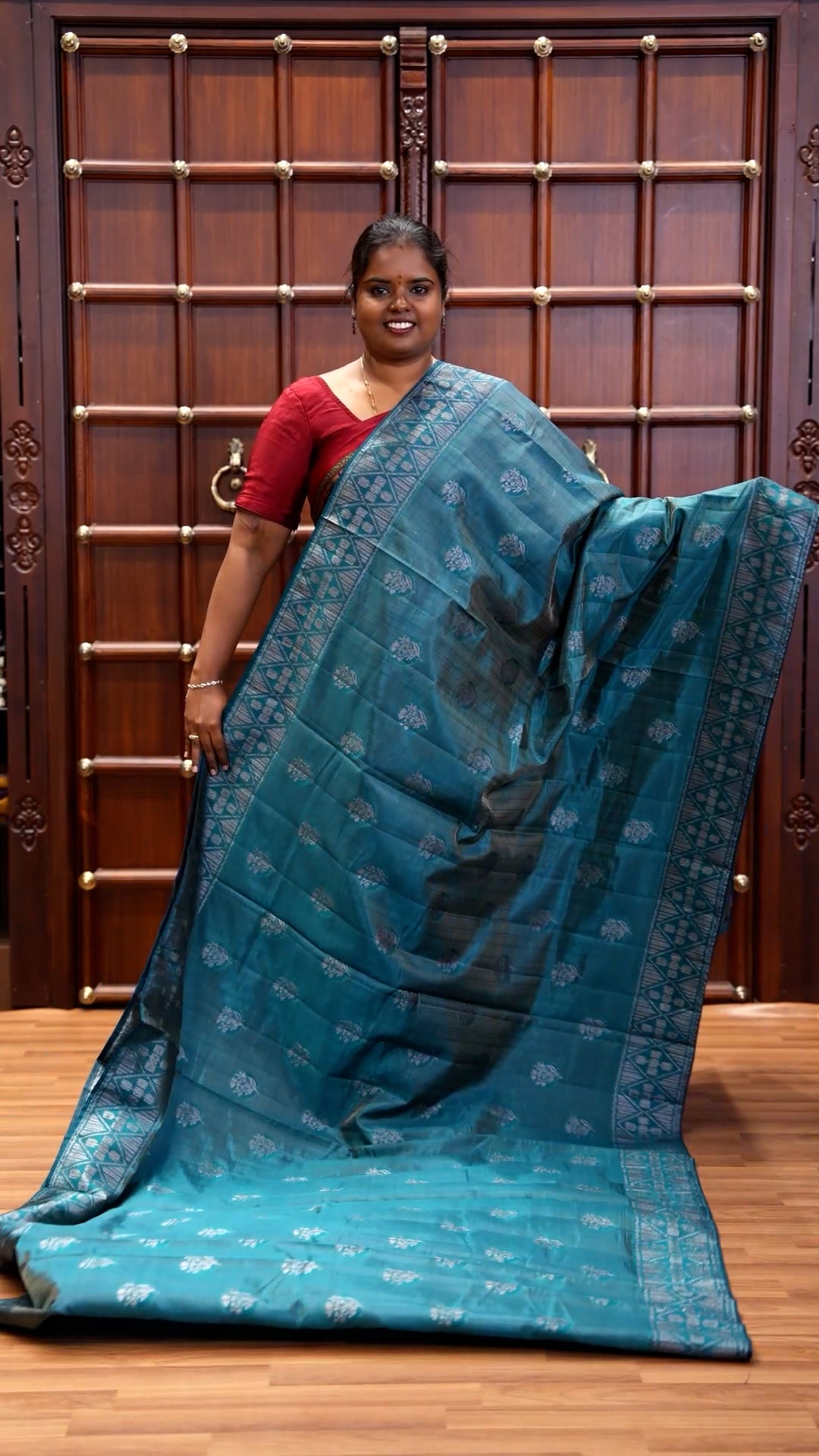 Blue Semi-Tussar Saree Subtly Woven With Floral Zari Buttas, Featuring a Geometric-Patterned Zari Border, Adorned With a Butta-Enclosed Checked Pallu, and a Matching Blouse