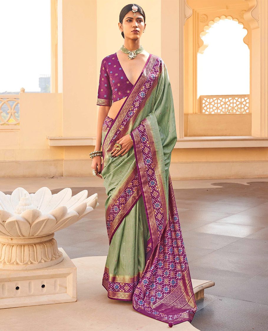 Pista Green Ikat Patola Designer Saree, Subtly Woven with Ikat Buttas, Complemented by a Contrast Ikat Border, Intricate Pallu, and a Contrast Blouse