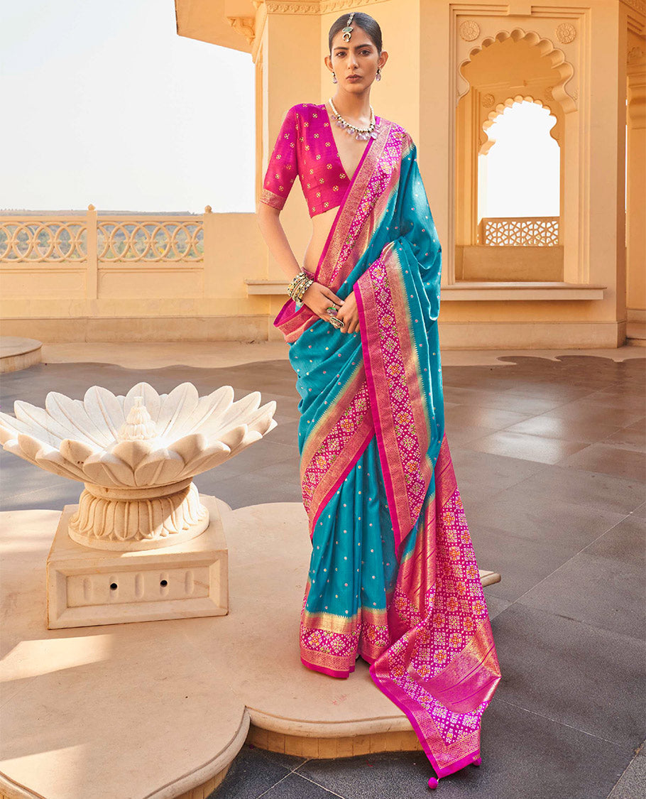 Blue Ikat Patola Designer Saree, Subtly Adorned with Ikat Buttas, Complemented by a Contrast Ikat Border, Intricate Pallu, and a Contrast Blouse