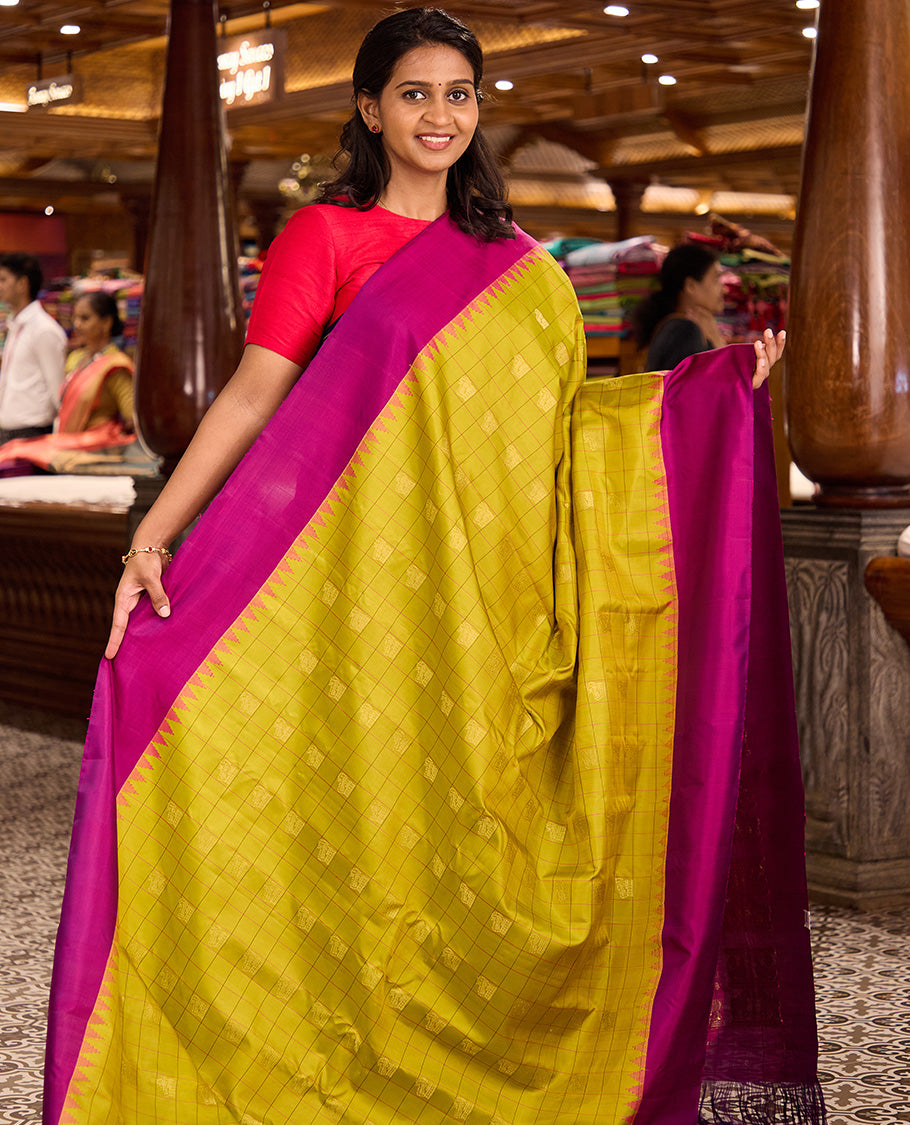 Green buttas enclosed checked gadwal silk saree, contrast thazampoo rekku plain border, and pallu of mayil, and kuthirai designs