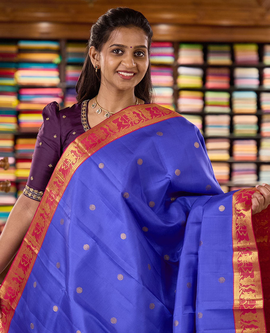 Royal blue chakram buttas Kanchipuram silk saree, contrast border of thilakam mokku,kathir, and Mythological characters, and pallu of Mythological motifs