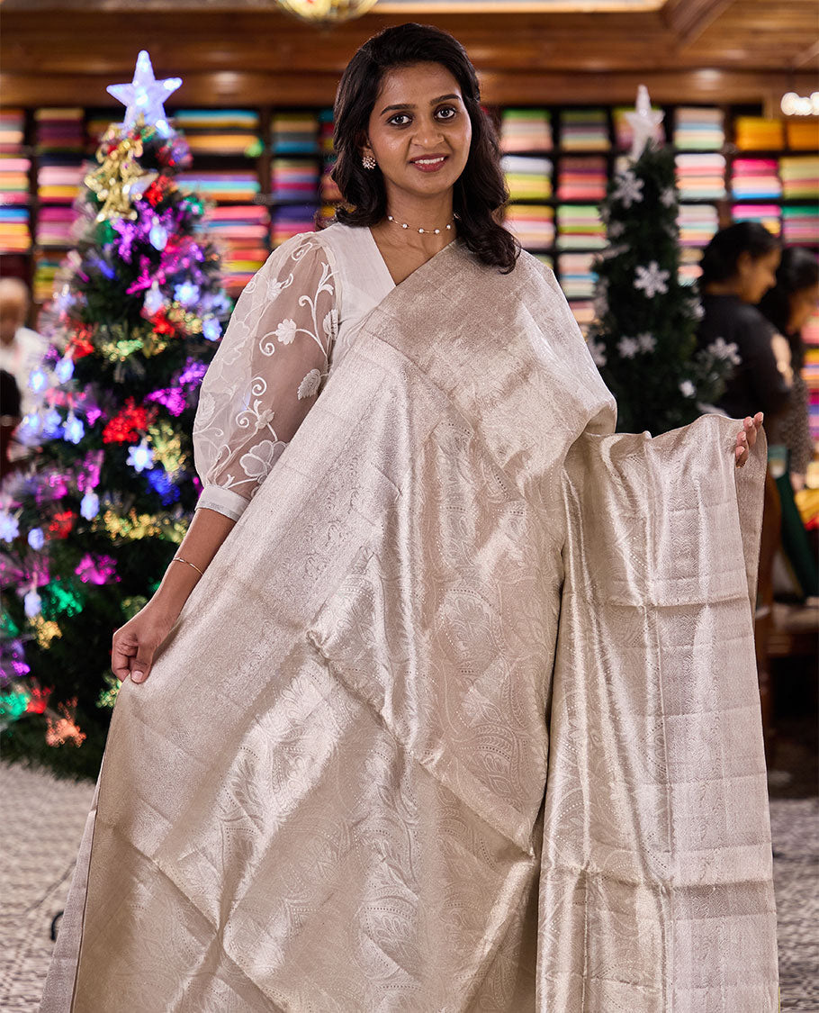 Pearl white Mughal-style ogee jacquard silk saree, traditional zari motifs sparsely woven border, and pallu