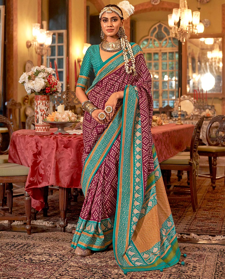 Wine diamond patola designer catalog saree, contrast patola border, and intricately patola designed pallu