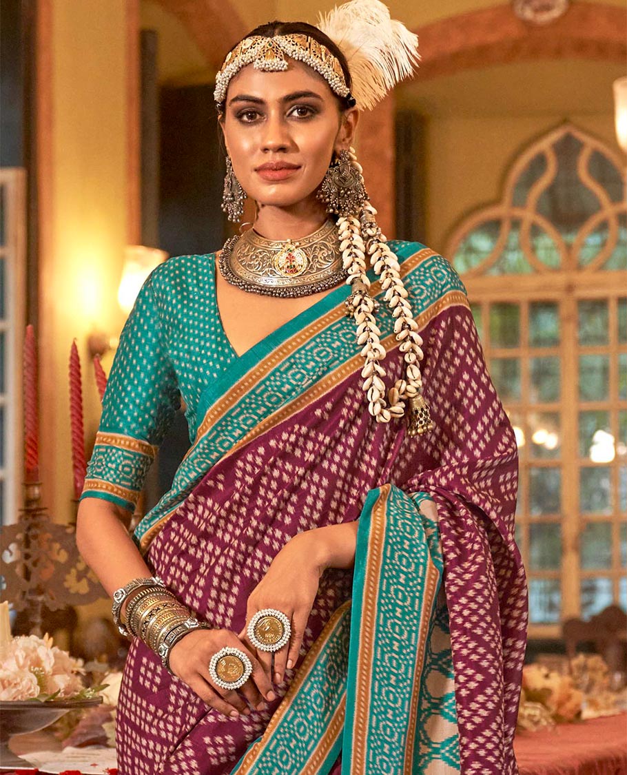 Wine diamond patola designer catalog saree, contrast patola border, and intricately patola designed pallu