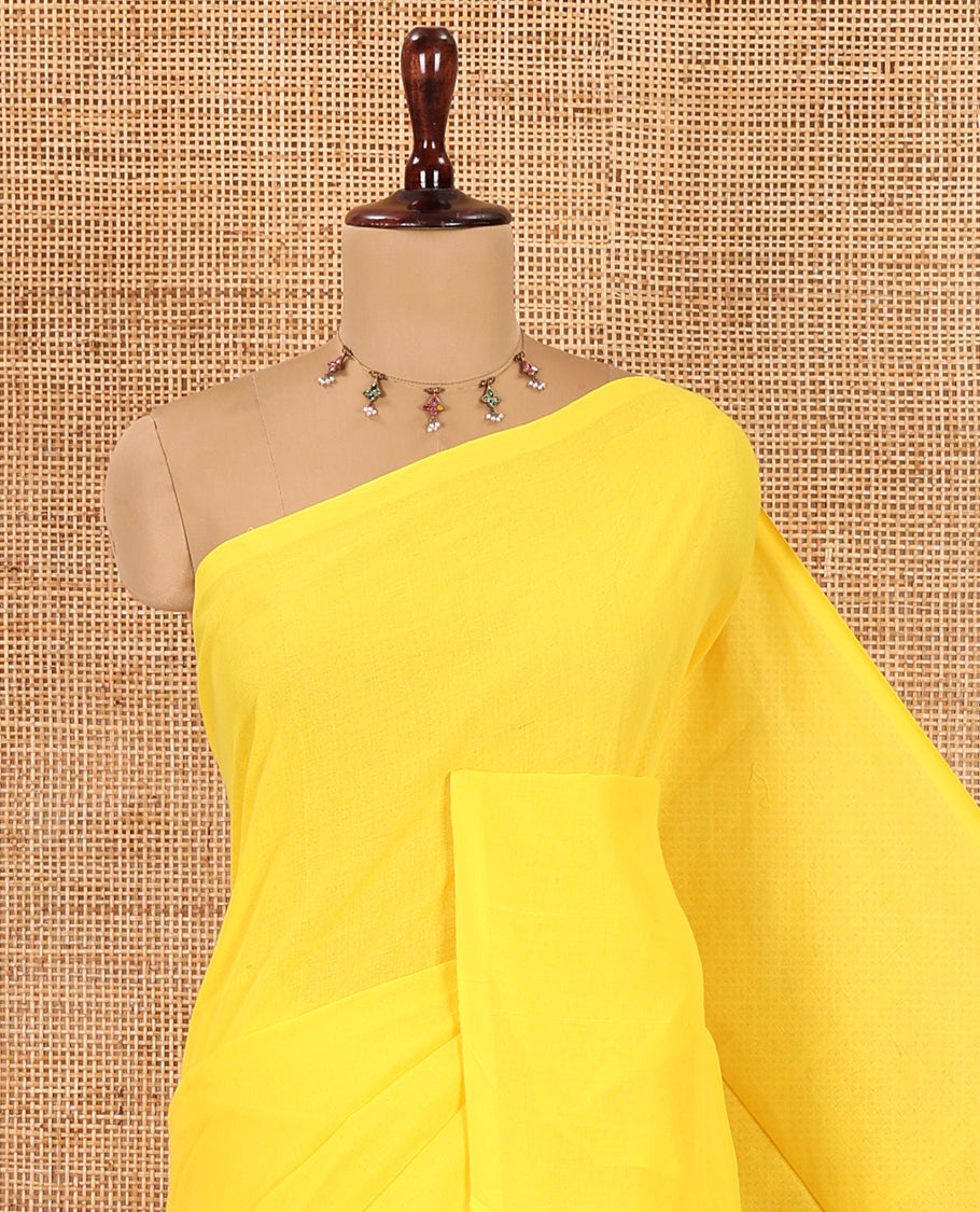 Borderless Yellow Plain Khadi Cotton Saree, a Self-Pallu with Tassels, and a Matching Blouse