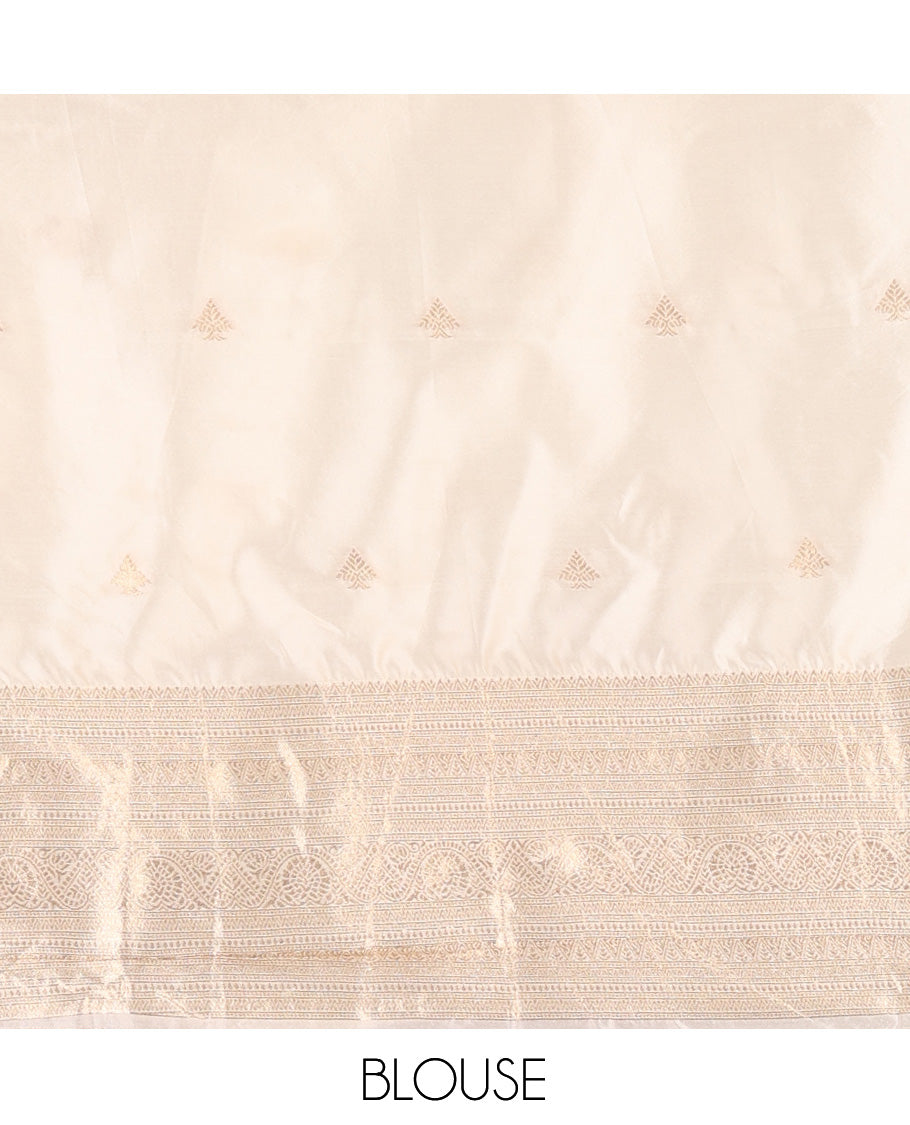 Cream Semi-Banarasi Half Saree, Zari Buttas Skirt, a Matching Blouse, and Intricately Designed Dhavani
