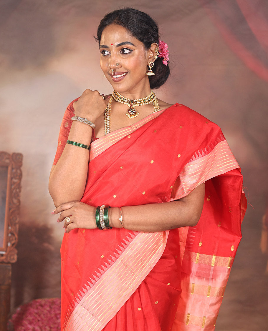 Red Vasundhara Silk Saree, Gracefully Woven with Kamalam Buttas on Its Body, Complemented by a Captivating Contrast Thazampoo Rekku Border of Banaras Designs, Zari-Decked Up Pallu, and Paired with a Contrast Blouse