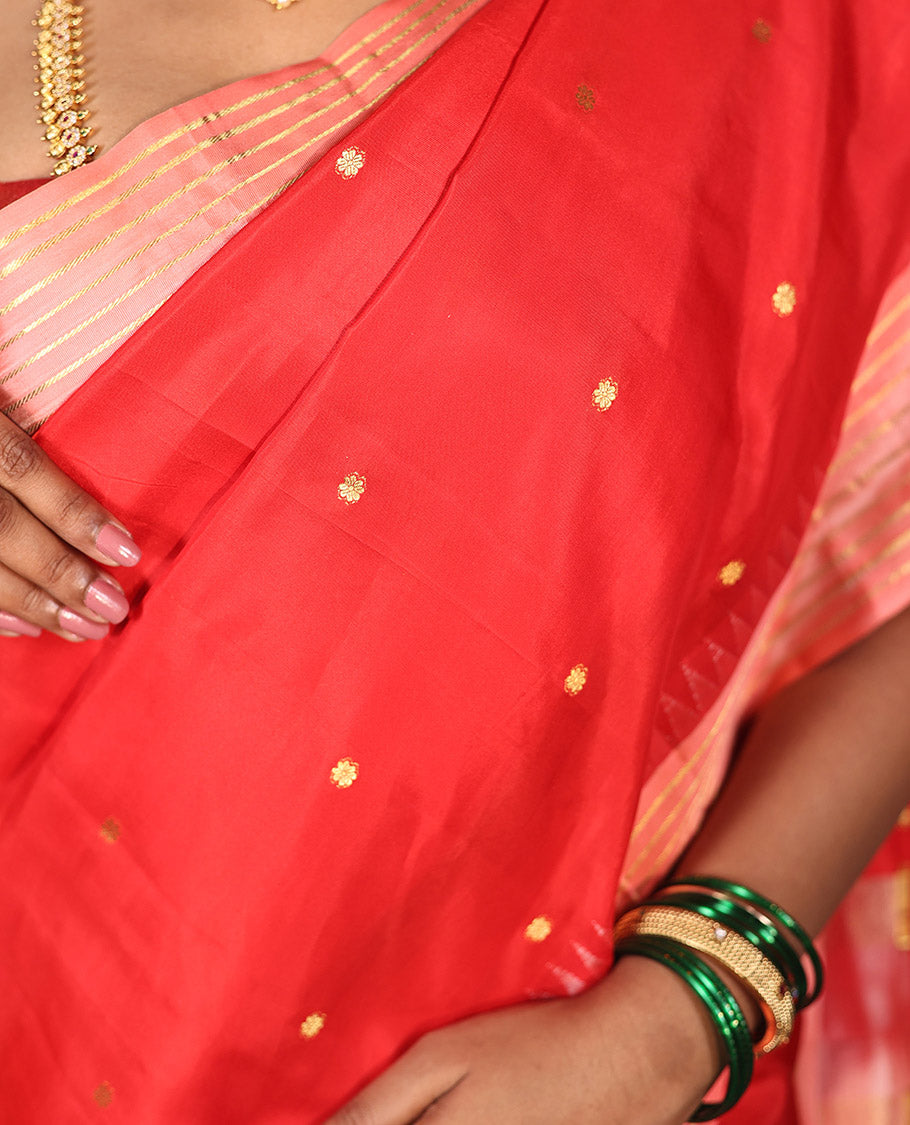 Red Vasundhara Silk Saree, Gracefully Woven with Kamalam Buttas on Its Body, Complemented by a Captivating Contrast Thazampoo Rekku Border of Banaras Designs, Zari-Decked Up Pallu, and Paired with a Contrast Blouse