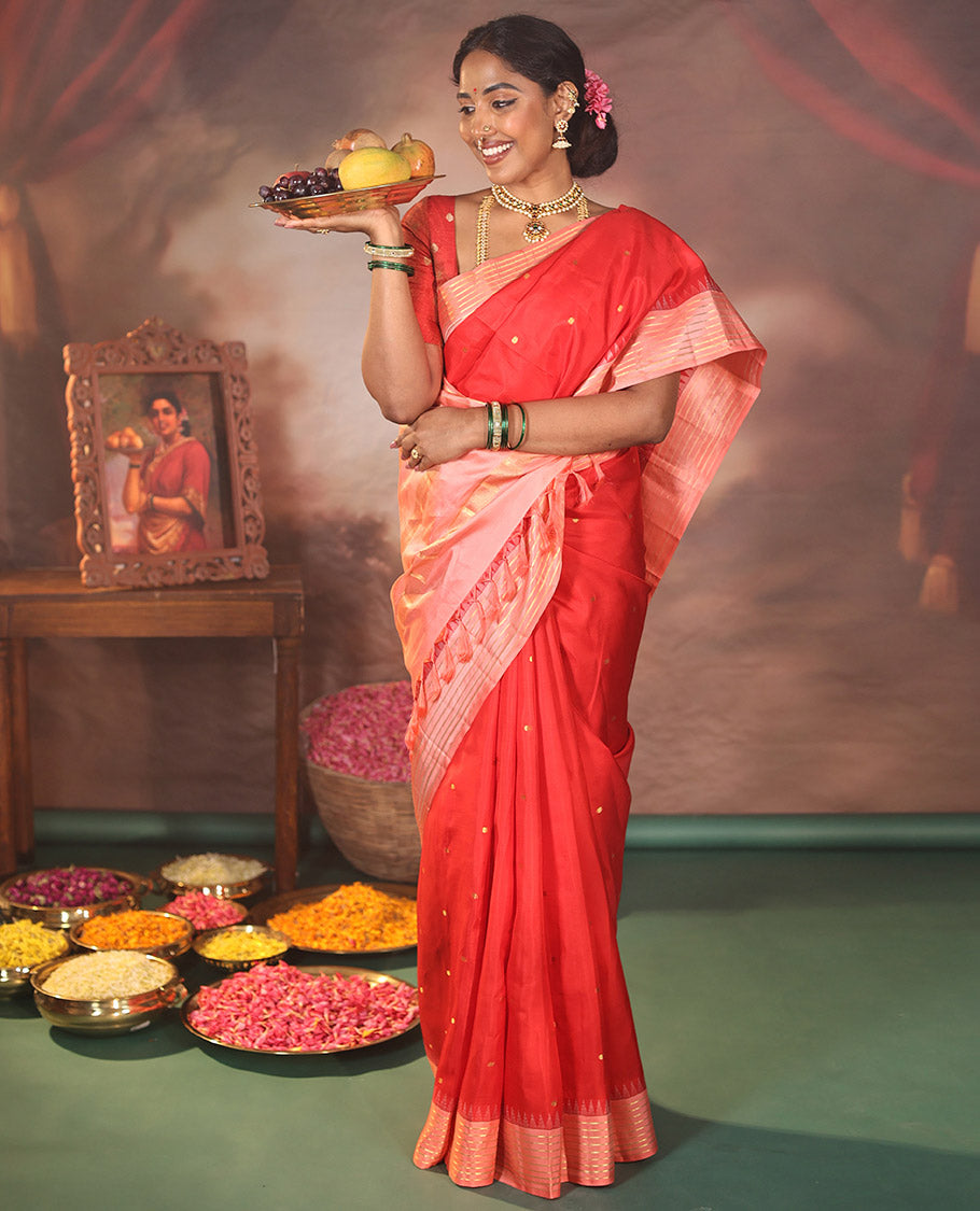 Red Vasundhara Silk Saree, Gracefully Woven with Kamalam Buttas on Its Body, Complemented by a Captivating Contrast Thazampoo Rekku Border of Banaras Designs, Zari-Decked Up Pallu, and Paired with a Contrast Blouse