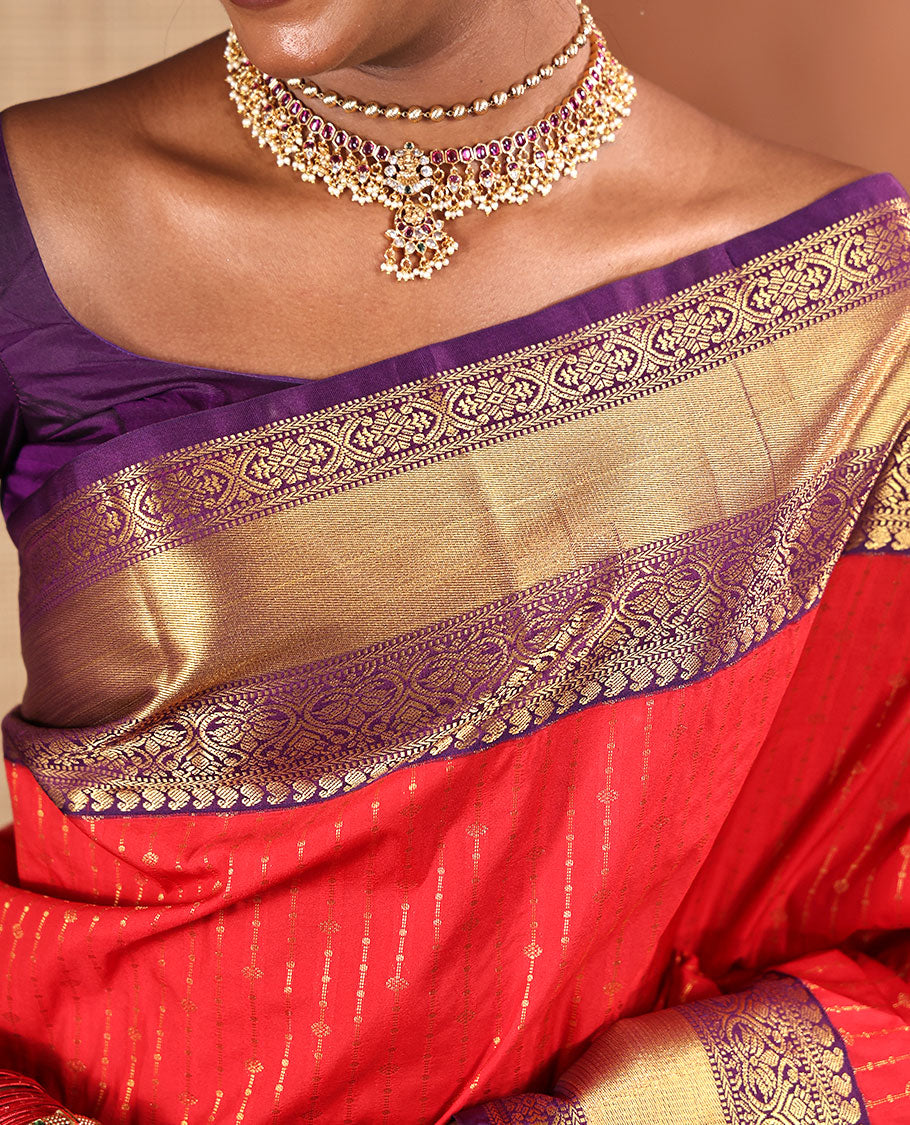 Red Budget Silk Saree, Embellished with Zari Stripes All Across Its Body, Complemented by Captivating Contrast Traditional Zari Designs Woven Border, Grandly Decked Up Jaal Patterned Pallu, and Paired with a Contrast Blouse