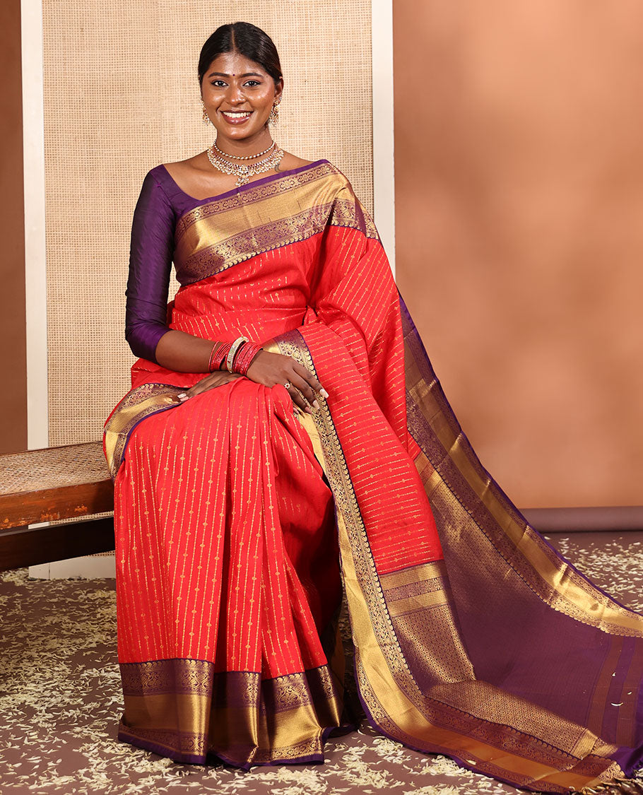 Red Budget Silk Saree, Embellished with Zari Stripes All Across Its Body, Complemented by Captivating Contrast Traditional Zari Designs Woven Border, Grandly Decked Up Jaal Patterned Pallu, and Paired with a Contrast Blouse