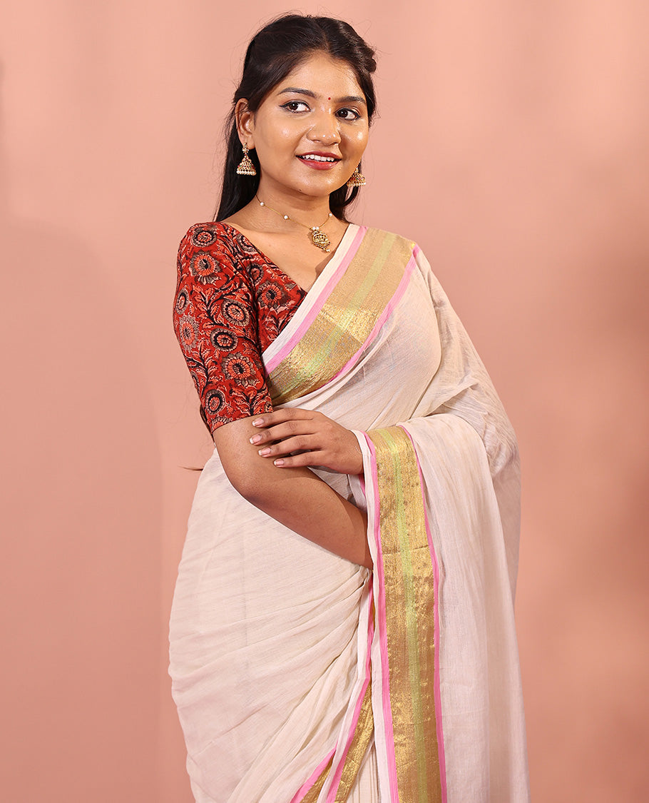 Cream Khadi mul cotton saree, contrast bavanji border, self-pallu with tassels, and a matching blouse