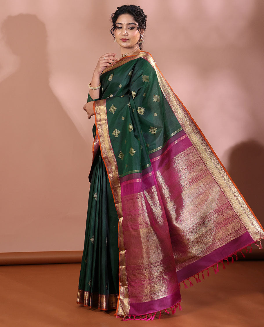 Green Kanchipuram Soft Silk Saree Artfully Detailed with Kolam Buttas, Complemented by a Contrast Border of Thilakam Mokku, Muthu, Yaanai, and Mayil Designs, Zari-Rich Pallu of Mayil Kann Designs, and Paired with a Contrast Blouse