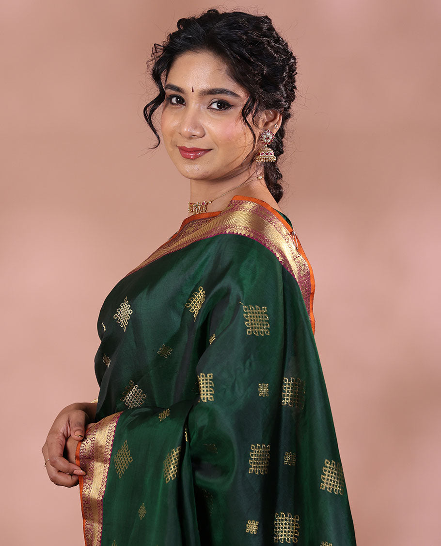Green Kanchipuram Soft Silk Saree Artfully Detailed with Kolam Buttas, Complemented by a Contrast Border of Thilakam Mokku, Muthu, Yaanai, and Mayil Designs, Zari-Rich Pallu of Mayil Kann Designs, and Paired with a Contrast Blouse