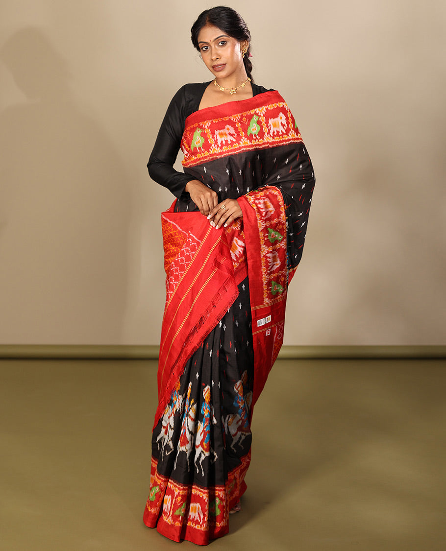 Black Pochampally Ikat Saree, Adorned with Buttas and Horse Rider Ikat Weave, a Contrast Ikat Animal Weave Border, Jaal Pallu, and a Contrast Blouse