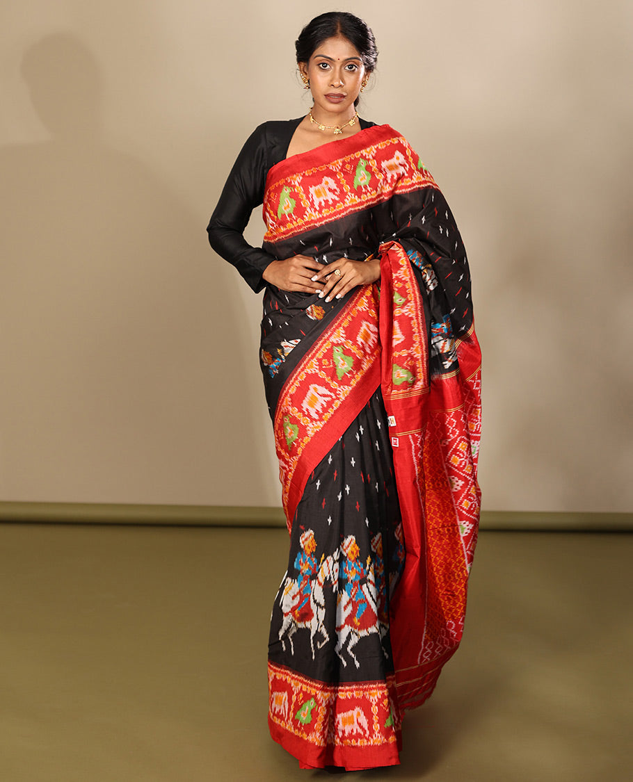 Black Pochampally Ikat Saree, Adorned with Buttas and Horse Rider Ikat Weave, a Contrast Ikat Animal Weave Border, Jaal Pallu, and a Contrast Blouse