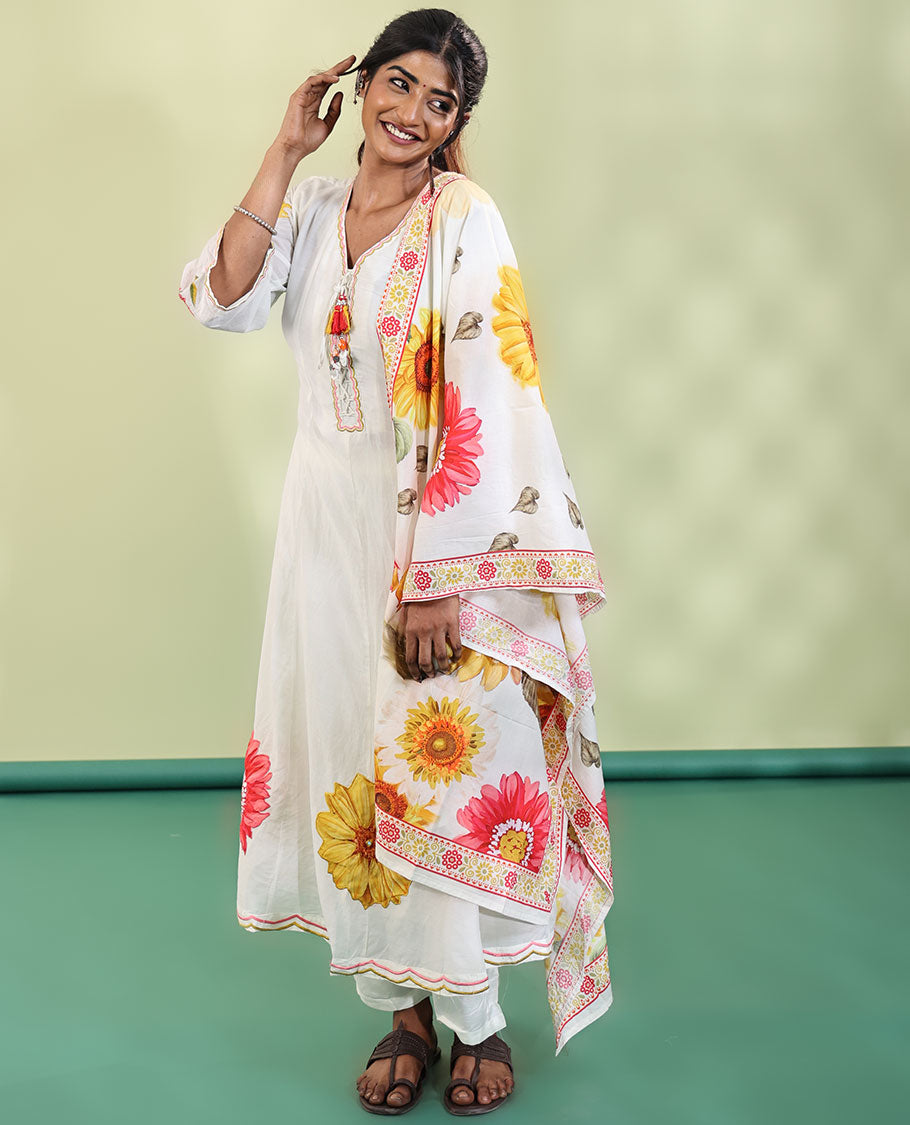 White Cotton Readymade Suit, Features Sunflower Print with Outline Embroidered V-neck 3/4 th Sleeved Umbrella Top, a Subtle Straight-Cut Pants, and a Floral Print-Embroidered Dupatta