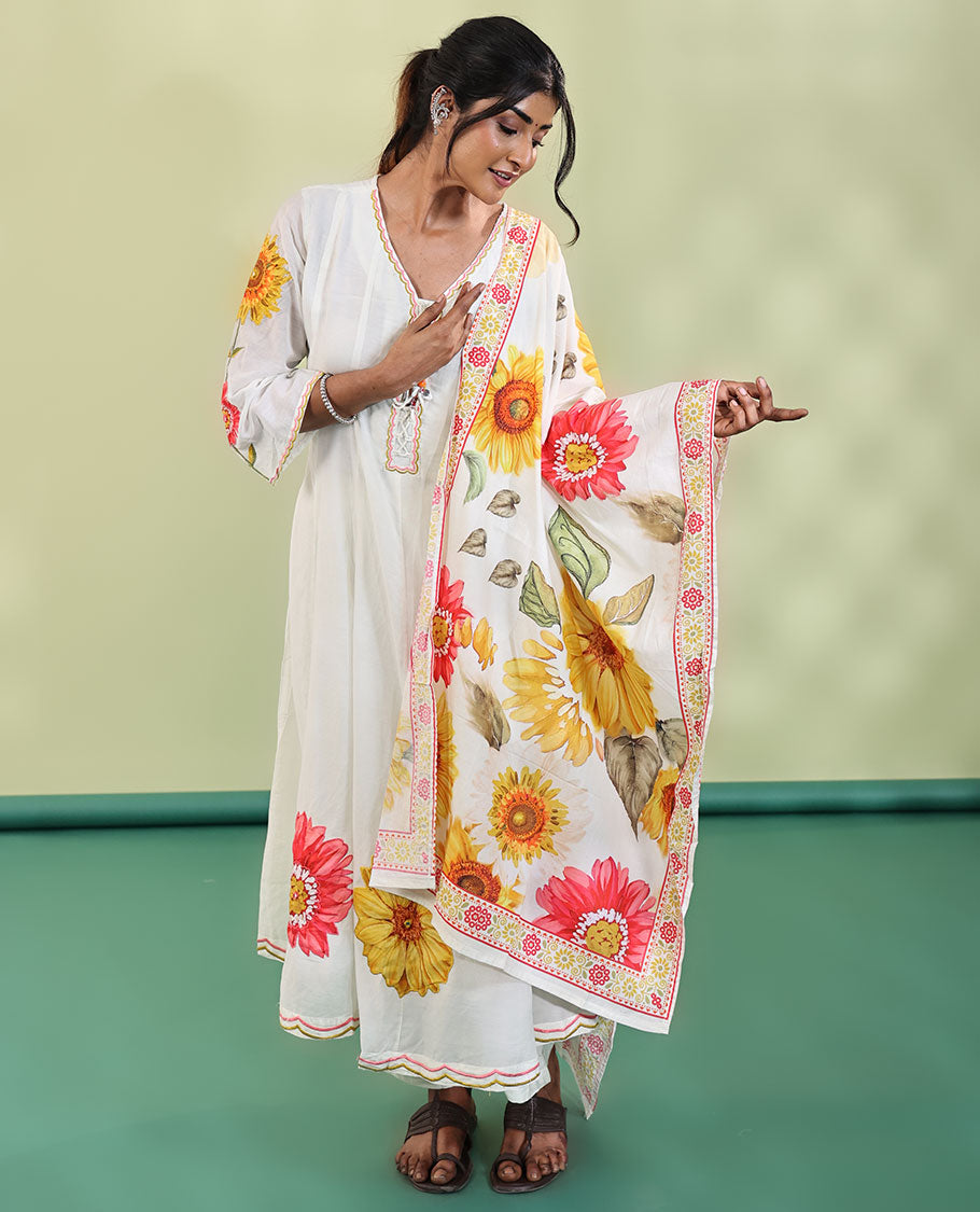 White Cotton Readymade Suit, Features Sunflower Print with Outline Embroidered V-neck 3/4 th Sleeved Umbrella Top, a Subtle Straight-Cut Pants, and a Floral Print-Embroidered Dupatta