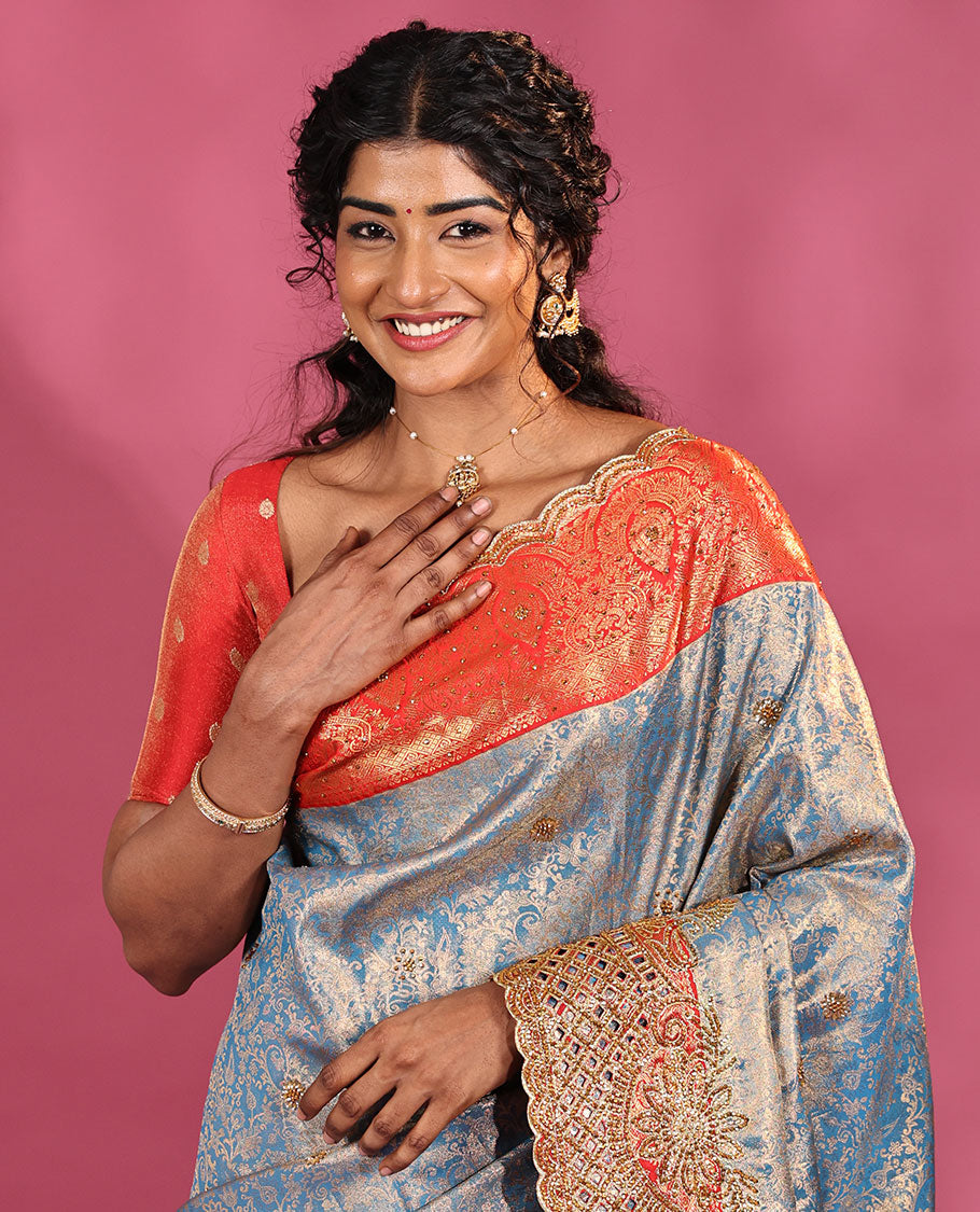Blue Vastrakala Silk Saree, Adorned with Floral Jacquard and Stone Work, Complemented by Contrast Traditional Zari and Cut Embroidered Scallop Border, Gleaming Grand Zari-Stone Work Pallu, and Paired with Contrast Heavy Stone Embroidered Blouse