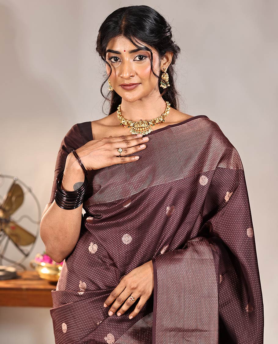 Coffee Brown Vasundhara Silk Saree, Finely Crafted with Raindrop Buttas, and Annam Chakram Bu\ttas on Its Body, Highlighted by a Zari Geometric-Textured Border, Gleaming Copper-Colored Zari Pallu of Jaal Designs, and Paired with a Matching Blouse