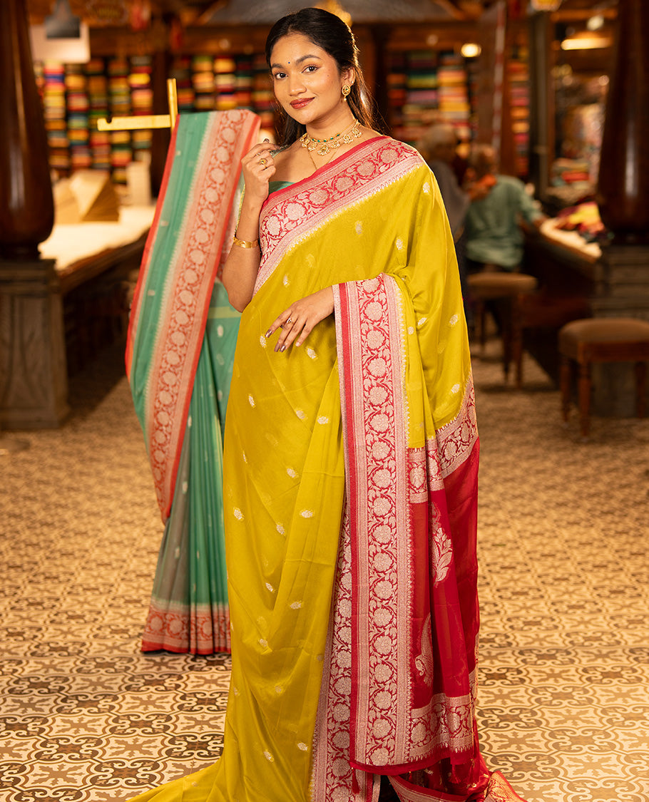 Mustard Banarasi Georgette Saree, Ornamented with Zari Buttas All Over Its Body, Complemented by a Contrast Floral Creeper Design Border, Pallu of Paisleys, and Paired with a Contrast Blouse