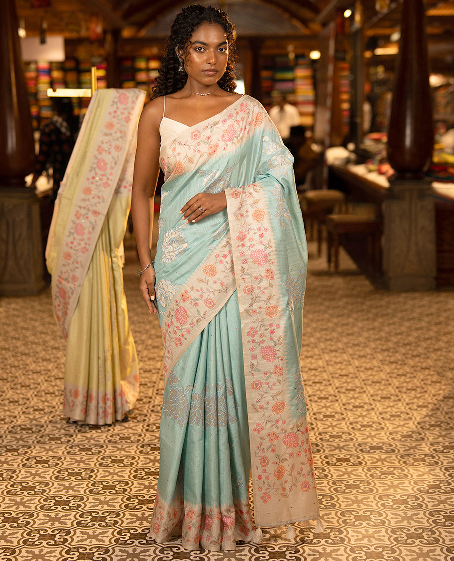 Sky Blue Fancy Tussar Silk Saree, Gleamed Up with Small Gold Buttas, and Applique Embroidery on Its Body, Complemented by a Contrast Temple Floral Creeper Printed Border, Pallu of Floral Creeper Print, and Paired with a Contrast Blouse