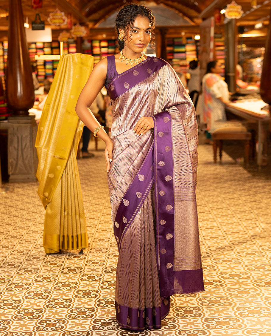 Purple Russian Dola Silk Saree, Meticulously Crafted with Zari Zig-Zag Jacquard on Its Body, Highlighted by Zari Buttas Woven Satin Border, Intricately Designed Pallu, and Paired with a Matching Blouse