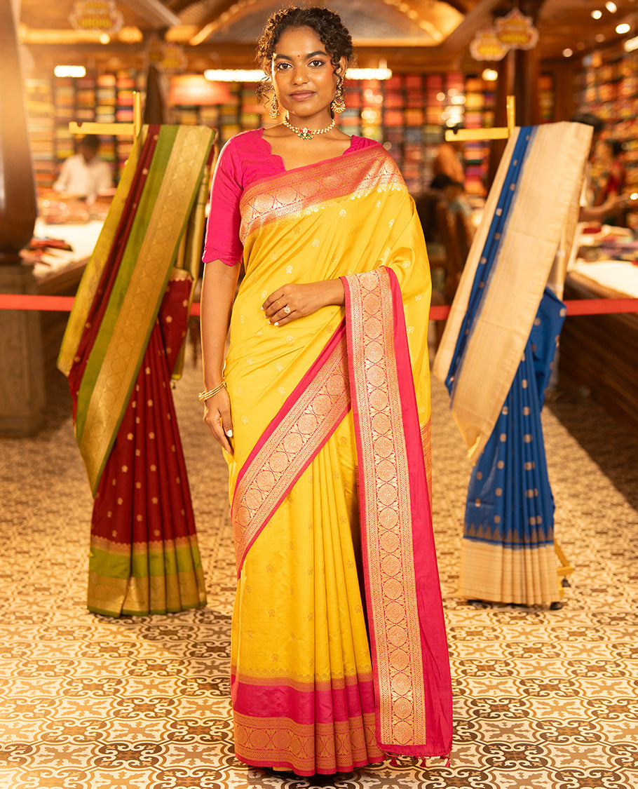 Mustard Yellow Dupion Silk Saree, Embellished with Buttas All Over Its Body, Complemented by Contrast Traditional Border of Paisleys and Chakram Designs, Intricately Designed Pallu, and Paired with a Contrast Blouse