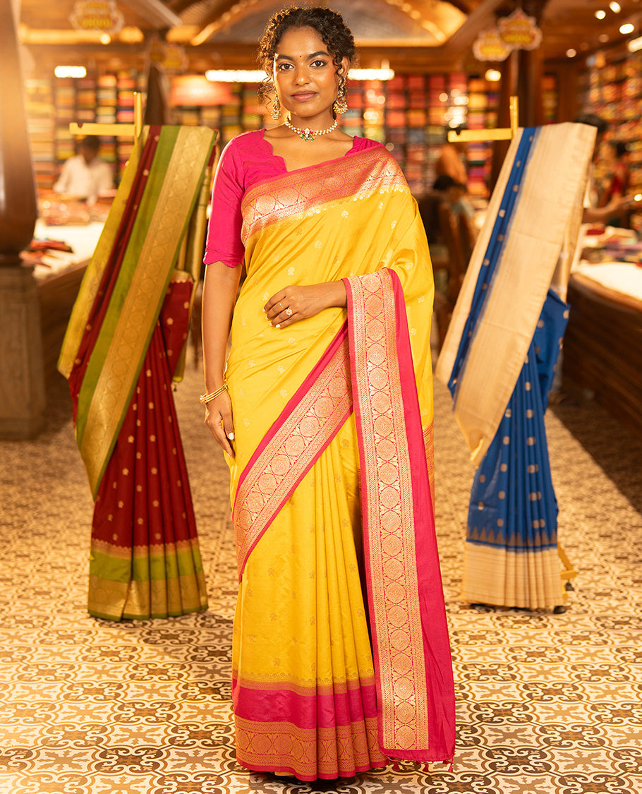 Mustard Yellow Dupion Silk Saree, Embellished with Buttas All Over Its Body, Complemented by Contrast Traditional Border of Paisleys and Chakram Designs, Intricately Designed Pallu, and Paired with a Contrast Blouse