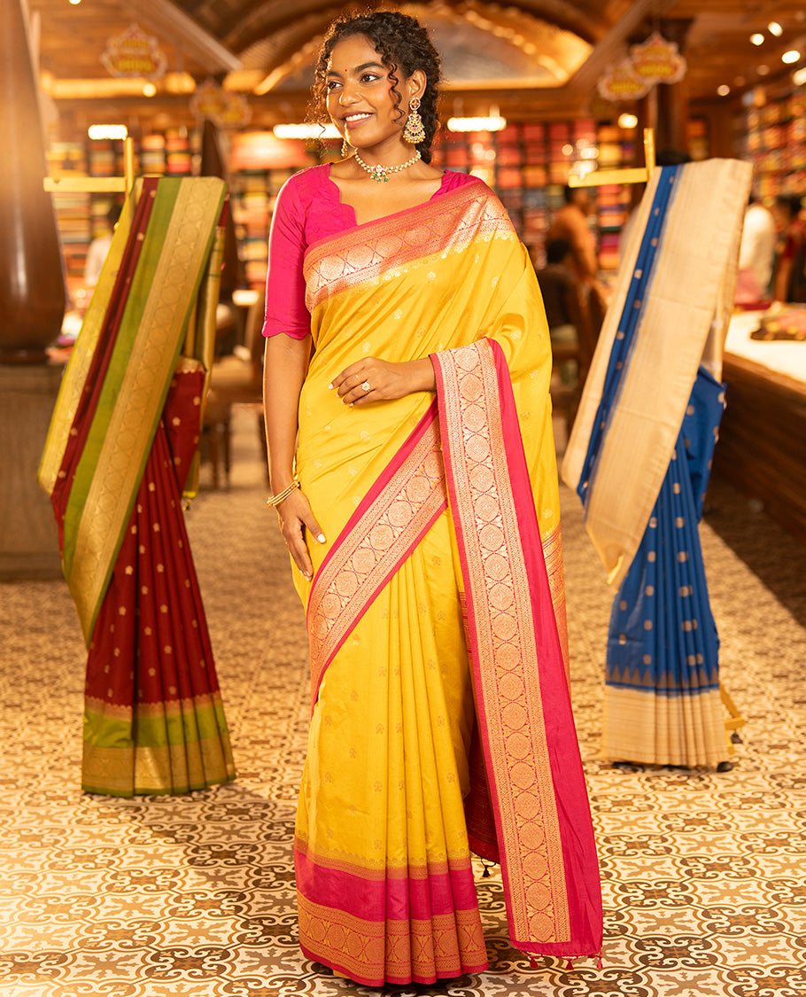 Mustard Yellow Dupion Silk Saree, Embellished with Buttas All Over Its Body, Complemented by Contrast Traditional Border of Paisleys and Chakram Designs, Intricately Designed Pallu, and Paired with a Contrast Blouse