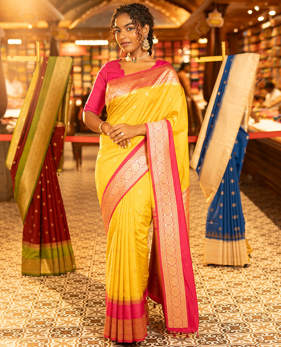 Mustard Yellow Dupion Silk Saree, Embellished with Buttas All Over Its Body, Complemented by Contrast Traditional Border of Paisleys and Chakram Designs, Intricately Designed Pallu, and Paired with a Contrast Blouse