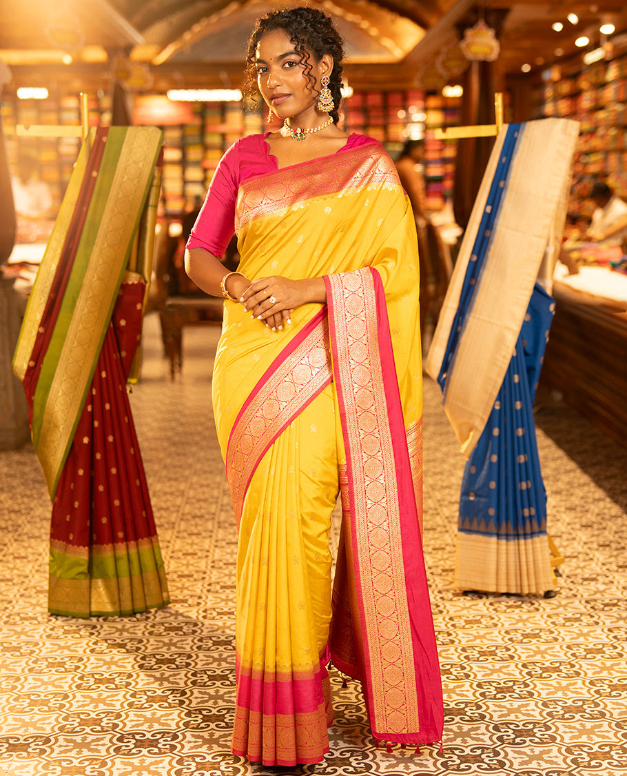 Mustard Yellow Dupion Silk Saree, Embellished with Buttas All Over Its Body, Complemented by Contrast Traditional Border of Paisleys and Chakram Designs, Intricately Designed Pallu, and Paired with a Contrast Blouse